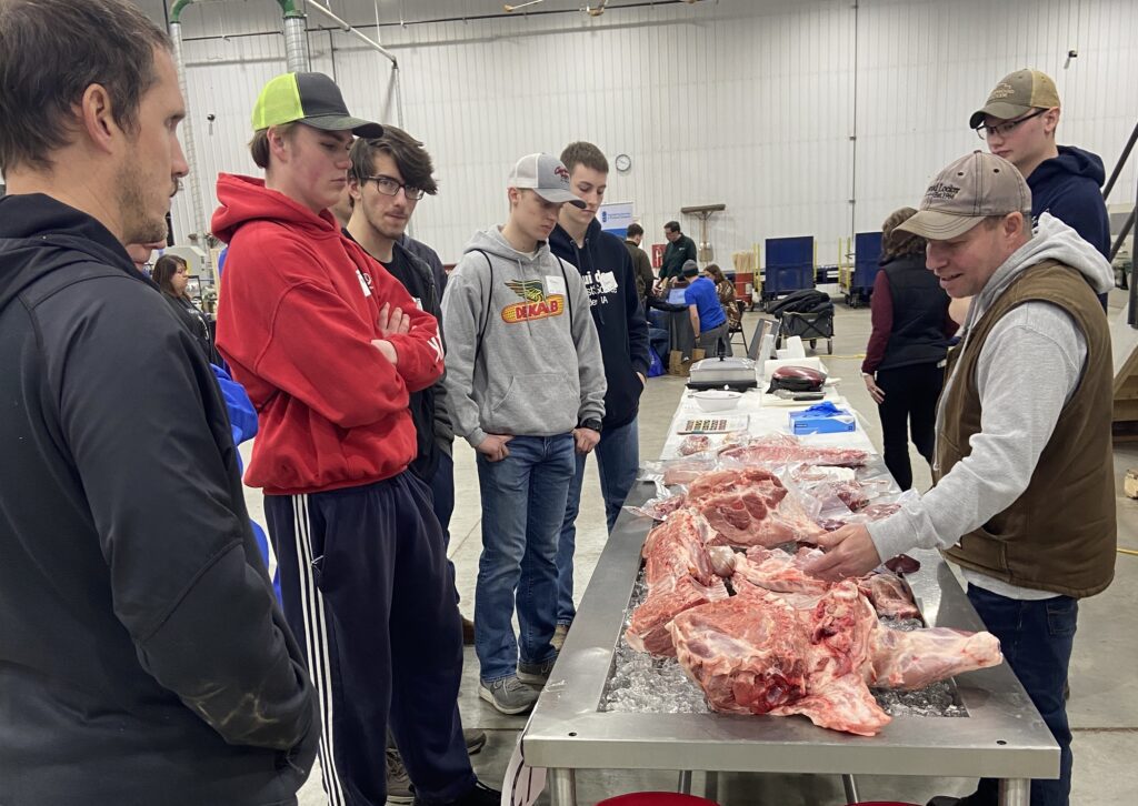 Students learn about a hog carcass.